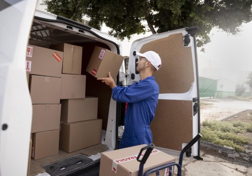 medium-shot-delivery-man-holding-pack-scaled